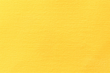 Yellow canvas background . Surface of fabric texture in autumn leaves color.
