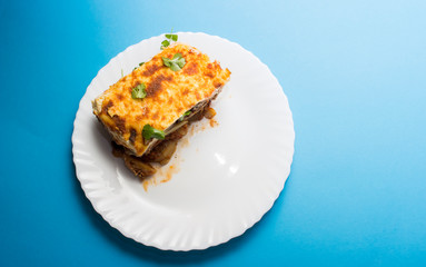 Traditional Greek dish Moussaka (Musaka).  Is an eggplant- or potato-based dish, often including ground meat