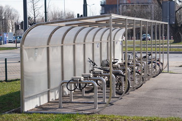 Parking for Bicycle near an apartment building with a large number of bicycles. Eco-friendly and sports transport in the city.