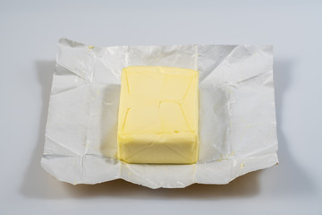 The wrapped butter is open for proper nutrition with amino acids for the normal functioning of the heart and itelect.