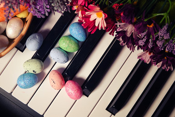 Paschal Easter Eggs and Piano Keys and Flowers - 333164429