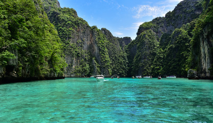 Breathtaking landscape in Koh Phi Phi with clear water and high limestone cliffs in great weather