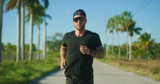 Male runner on rural road training