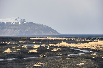 Northen landscapes: Blautakvisl glacier river and Hafursey mountain view in Myrdalssandur outwash plain (region of Sudurland, Iceland)