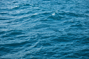 Obraz premium Splashing sea waves. Water surface wallpaper or background concept