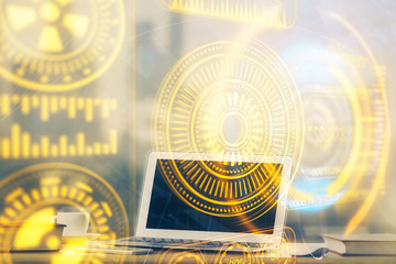 Computer on desktop in office with technology theme hologram. Multi exposure. Tech concept.