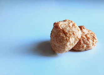 Coconut cookies on a blue background. Sweet pastries. Very tasty!!