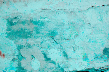 Blue background. Wall covered with old cracked stucco, tinted in classic blue. Bright neon backdrop. Modern urban industrial concept. Copy space. Selective focus image.