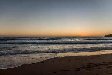 Fototapeta na wymiar empty surfing beach at sunrise