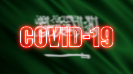 Blurred Saudi Arabia flag and neon text of 