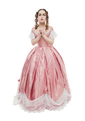 Young beautiful woman in long pink medieval dress pray  isolated