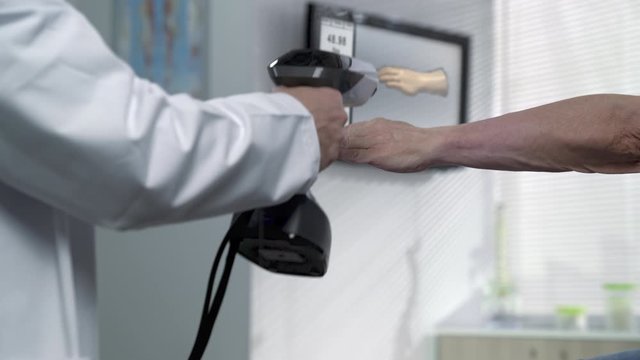Hand scanner 3d technology,doctor scanning patient hand  to acquire data for medical purpose