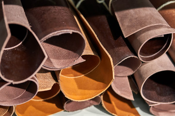 Closeup view at multicolored natural leather rolls
