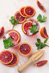 blood orange cocktail with ice and fresh mint