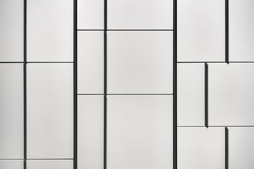 Obraz premium Closeup view at gray storage with dark handles