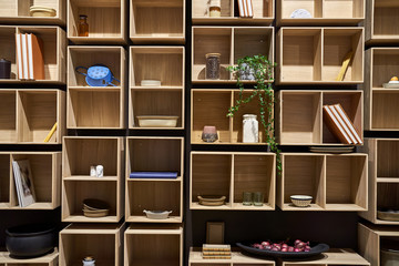 Construction of light wooden shelves with objects
