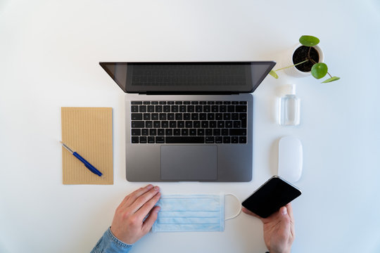 Top view of male working at home during quarantine, modern workspace concept 