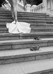 Sexy picture of naked woman with beautiful slim body without clothes leaving fress on steps and...