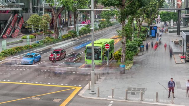 Aerial view of sidewalk and intersection of Orchard road in Singapore timelapse. Orchard road is one of best shopping district in Singapore.