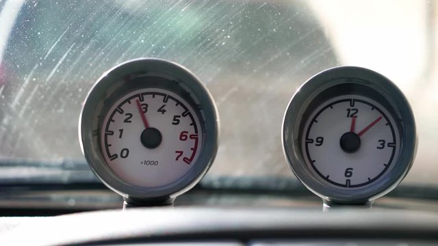 Tachometer and clock dashboard in car
