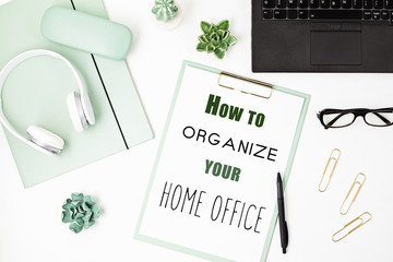 Fototapeta premium Top view of office desk. Table with laptop and office supplies. Flat lay home office workspace, remote work, distant learning, video conference, calls idea