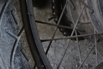 Old motorcycle tires that are cracked and worn
