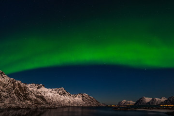 Obraz na płótnie Canvas The polar arctic Northern lights hunting aurora borealis sky star in Norway travel photographer mountains. long shutter speed.