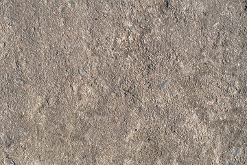 Natural natural texture of a stone slab with gray plaster in macro shot
