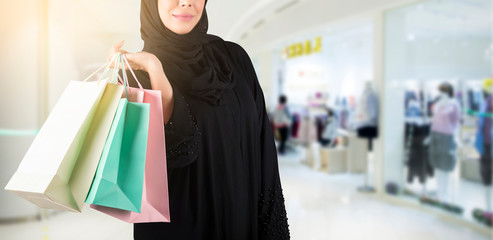 Arab woman holding shopping bags