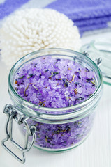 Obraz na płótnie Canvas Glass jar with purple bath salt (foot soak) wirh dry lavender. Close up, copy space.