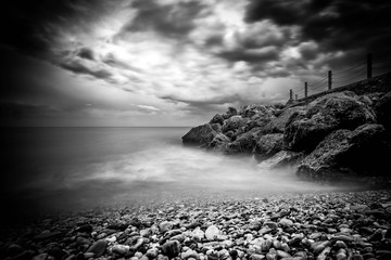 winter sea photographed from a black and white Italian beach
