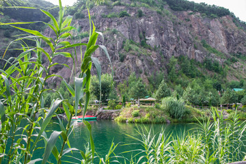 Fototapeta na wymiar natural stone pool under the mountain