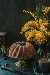 Cake with blueberries on a rustic background