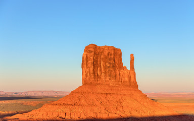 Fototapeta na wymiar Beautiful sunset over famous Butte of Monument Valley on the border between Arizona and Utah, USA