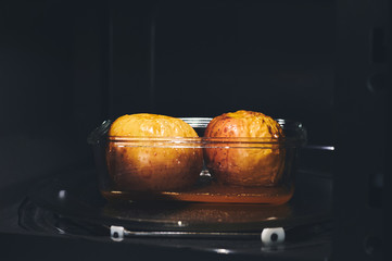 Two apples roasted in the microwave