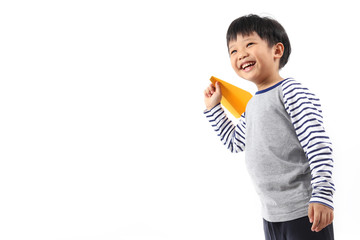 Boy holding paper airplane isolated on white background