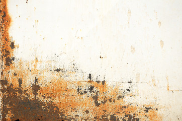 White metal door or wall close-up. Bright spots on a light background. Yellow, black and orange...