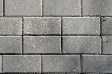Natural natural texture of stone paving slabs in a macro shot in sunny weather