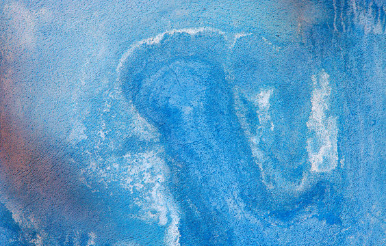 Fragment of old house wall close-up. Blue background. Peeling plaster on concrete surface. Cracks in paint. light blue tinted. Copy space. Place for text. Selective focus image. 