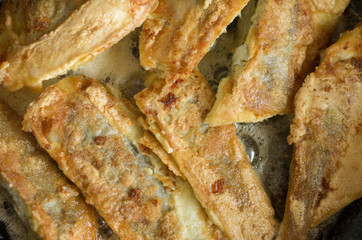 Fried in batter fish Whiting with a delicious crust top view