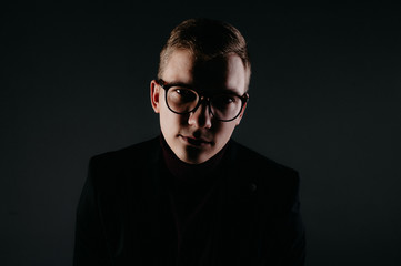Fototapeta premium A young male journalist with glasses.