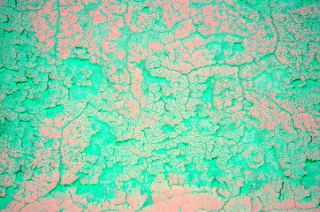 Old concrete wall. Peeling plaster on wall of house, building or fence surface. Toning in bright neon pink and blue colors. Modern urban backdrop. Copy space. Place for text. Selective focus image.