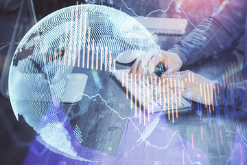 Double exposure of financial graph with man works in office on background. Concept of analysis.