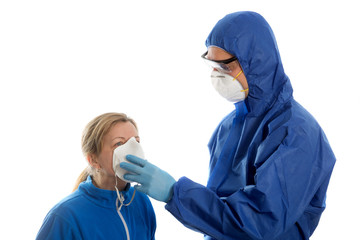 Man in protective clothing give face mask to women. Coronavirus concept.