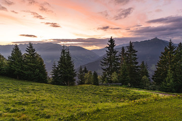 Panoramic view of the famous mountain peaks glowing in the beautiful golden evening light at sunset...