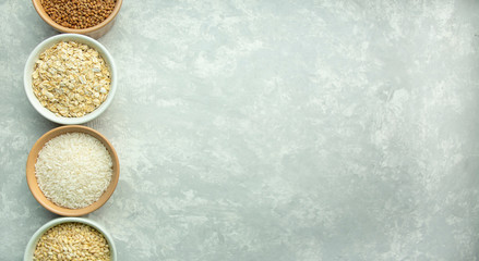 A collection of various cereals in bowls. Healthy eating Super food: rice, cereal, barley, buckwheat. Vegetarian food. Culinary background. Food background. Light background. Banner. Copy space.