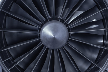 Fototapeta premium Turbine Engine. Aviation Technologies. Aircraft jet engine detail during maintenance. Blue toned.