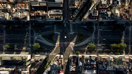 Aerial top view on iconic Obelisk and grand avenue in Buenos Aires, Argentina during golden hour (sunset time) with no people or traffic due to corona virus quarantine - 24 March 2020