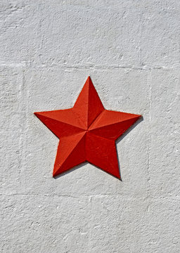vintage soviet red star on white stone surface, red army history memorial diversity