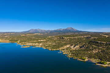 Aerial view of landscape american nature. Blue sky and lake,  mountains reflection in water. Recapture reservoir. Utah, USA